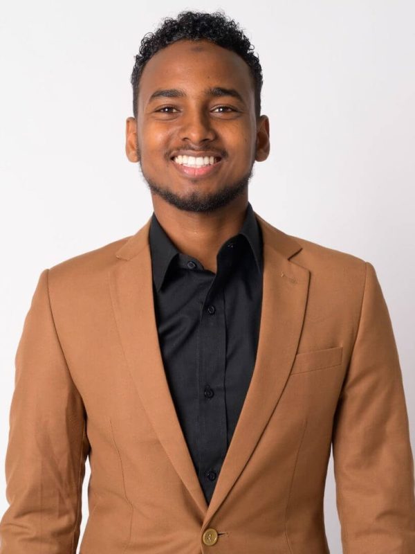 portrait-of-young-happy-african-businessman-smilin-2021-08-30-02-25-30-utc