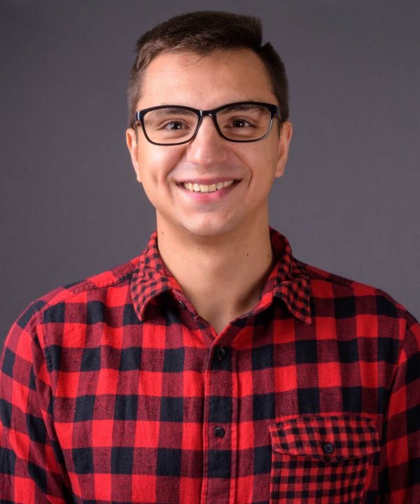 studio-shot-of-young-handsome-man-against-gray-bac-2021-08-27-20-57-06-utc-e1636609407671