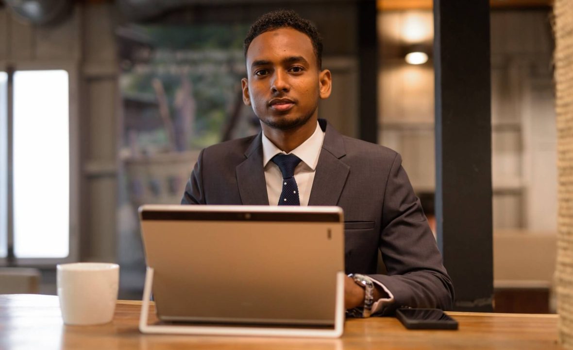 young-african-businessman-using-laptop-computer-at-2021-08-29-17-47-17-utc